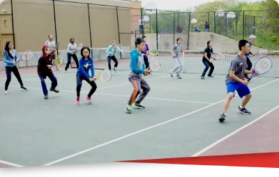 Youth tennis lesson on outdoor court